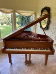 Young Chang Pramberger Signature Series Baby Grand Piano With Pecan Finish. Fixed Price $8900.00.