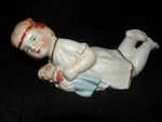 Antique Bisque Piano Baby Young Girl Holding Doll 7.5" Long. Fixed Price $49.99.