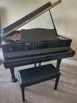 Young Chang Baby Grand Piano, Ebony G150 & Bench. Size:5'w X 5'l. Fixed Price $5000.00.