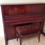 Schimmel Upright Piano Mahogany Finish With Floral Inlay + Adjustable Bench. Fixed Price $4400.00.