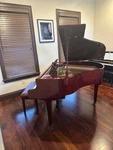 Excellent Condition Pre-owned Wurlitzer Mahogany Grand Piano C143. Fixed Price $5499.99.