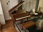 Howard No. 330 By Kawai Baby Grand Piano 5'1" Satin Walnut. Fixed Price $3250.00.